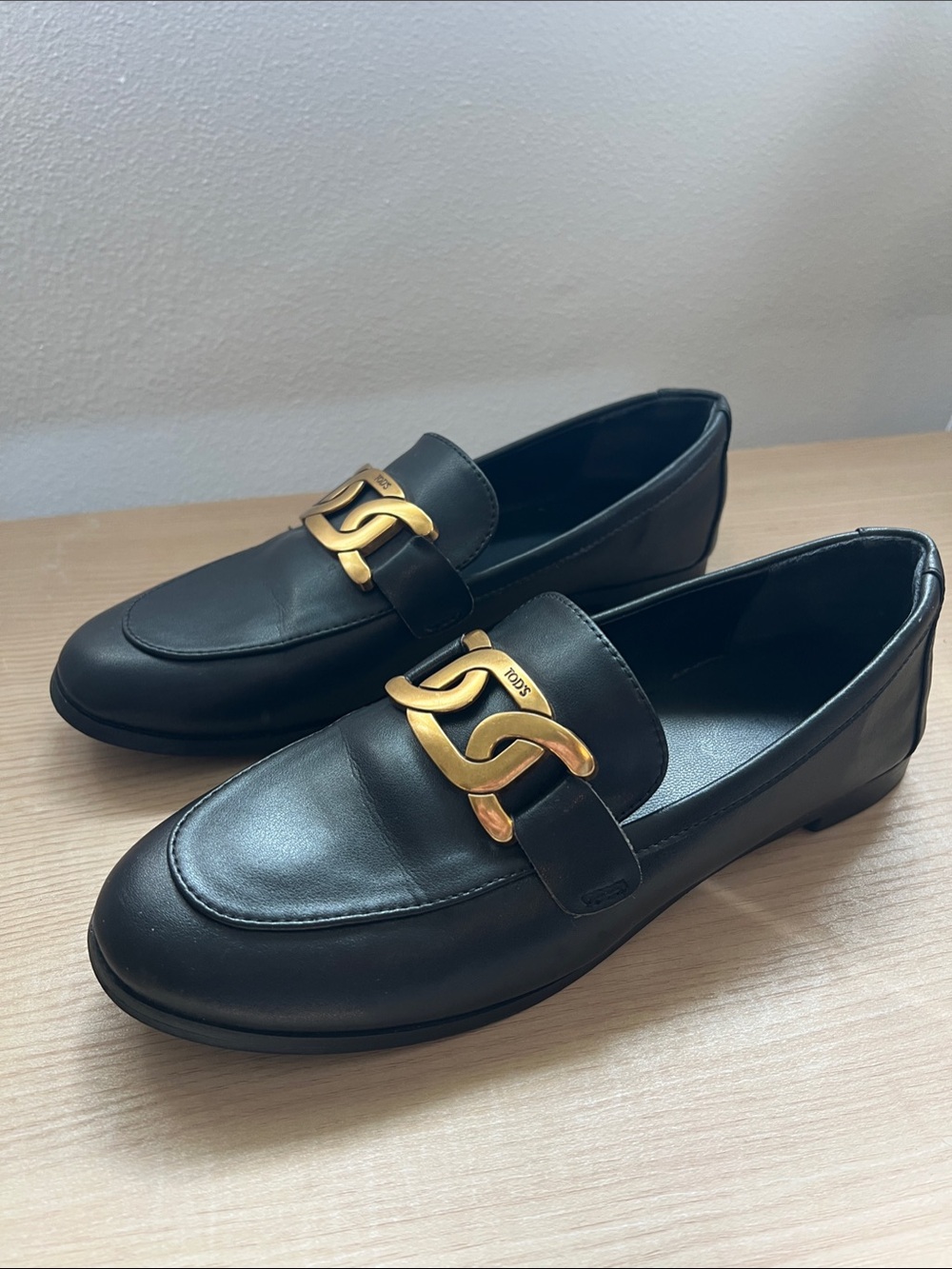 Tod's Black Leather Kate Loafers with Gold Chain Detail